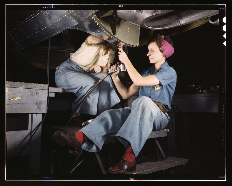 Women working under plane Women working under plane