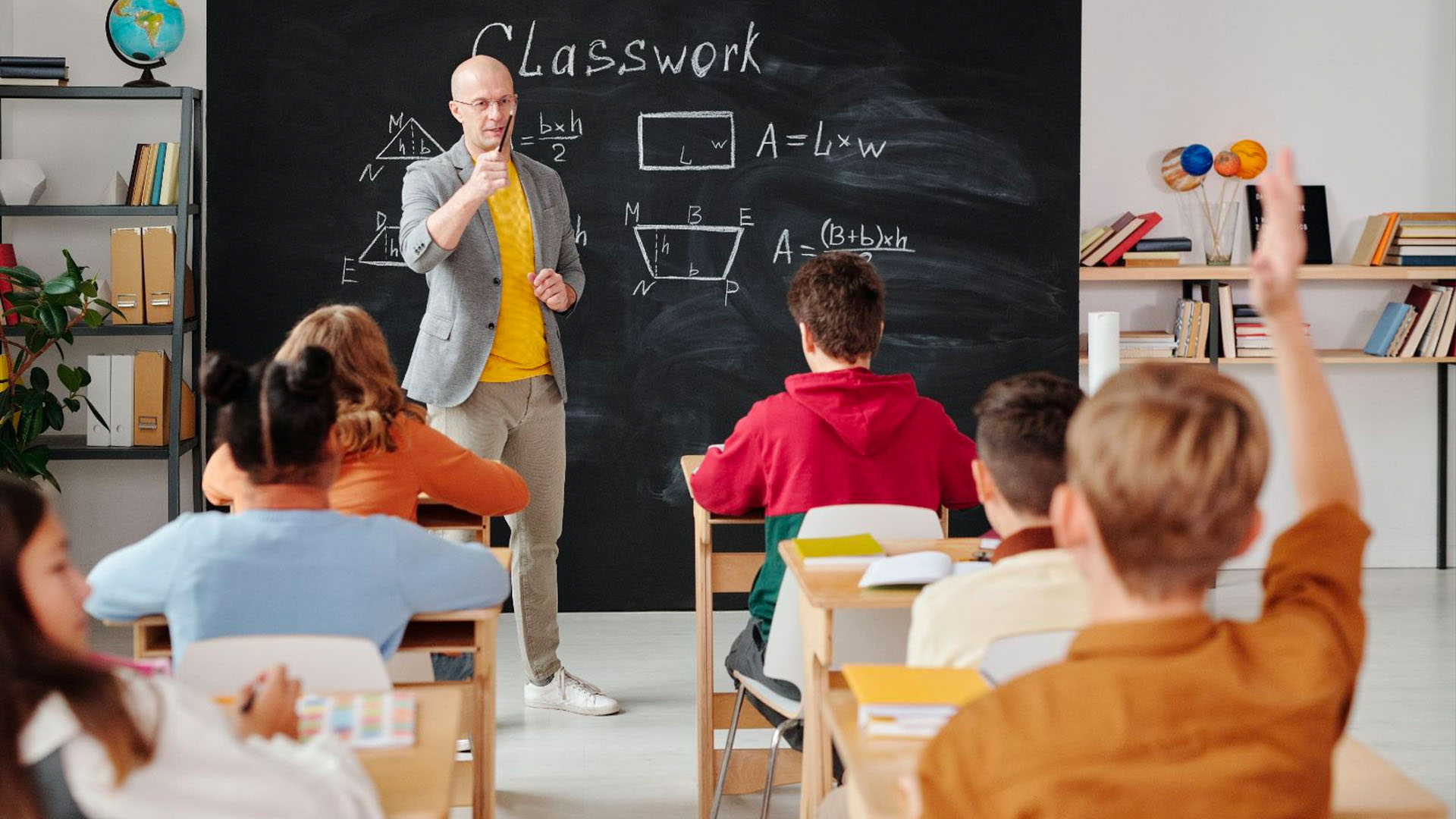 KInL - Financial Literacy in Classroom teacher teaching math in the classroom