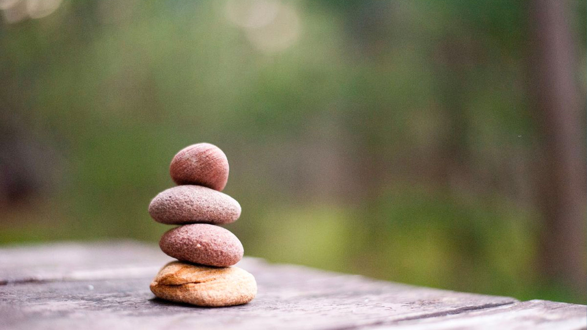 Keep IN Learning - Teacher Self-Care balancing rocks on a table