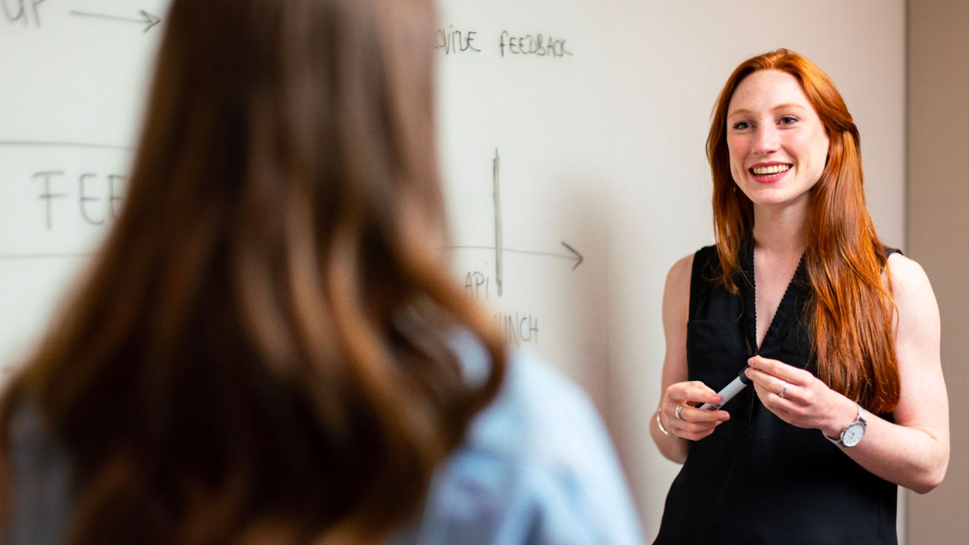Keep IN Learning - What is DOK smiling teacher at a whiteboard