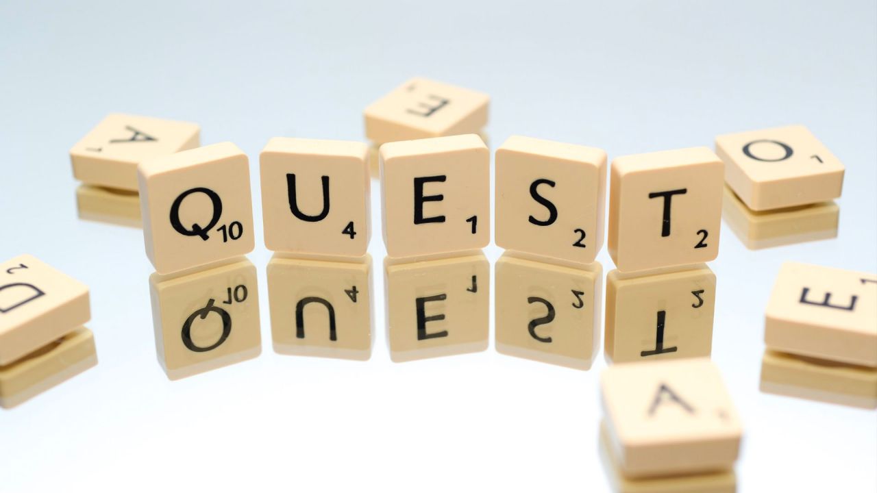 "QUEST" in scrabble tiles