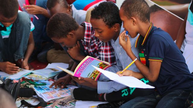 group of children working in workbooks together