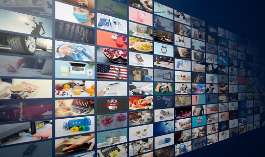 Television streaming, TV broadcast. Multimedia wall concept. room full of screens with different images on them