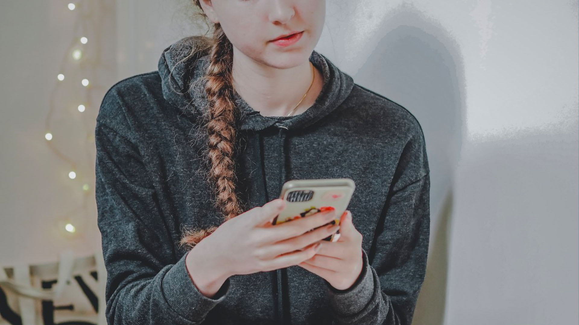 KInL - Digital Citizenship Abstinence-Only teenager holding and using a phone