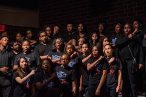 group of middle school students singing
