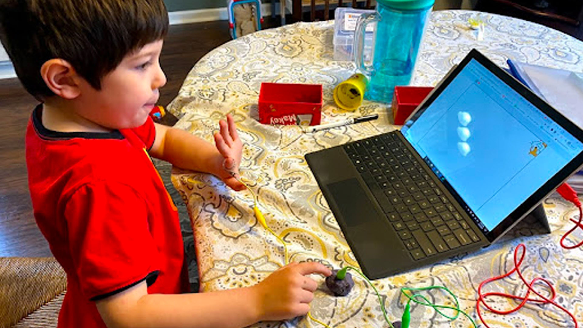 Makerspace at laptop kid working at laptop