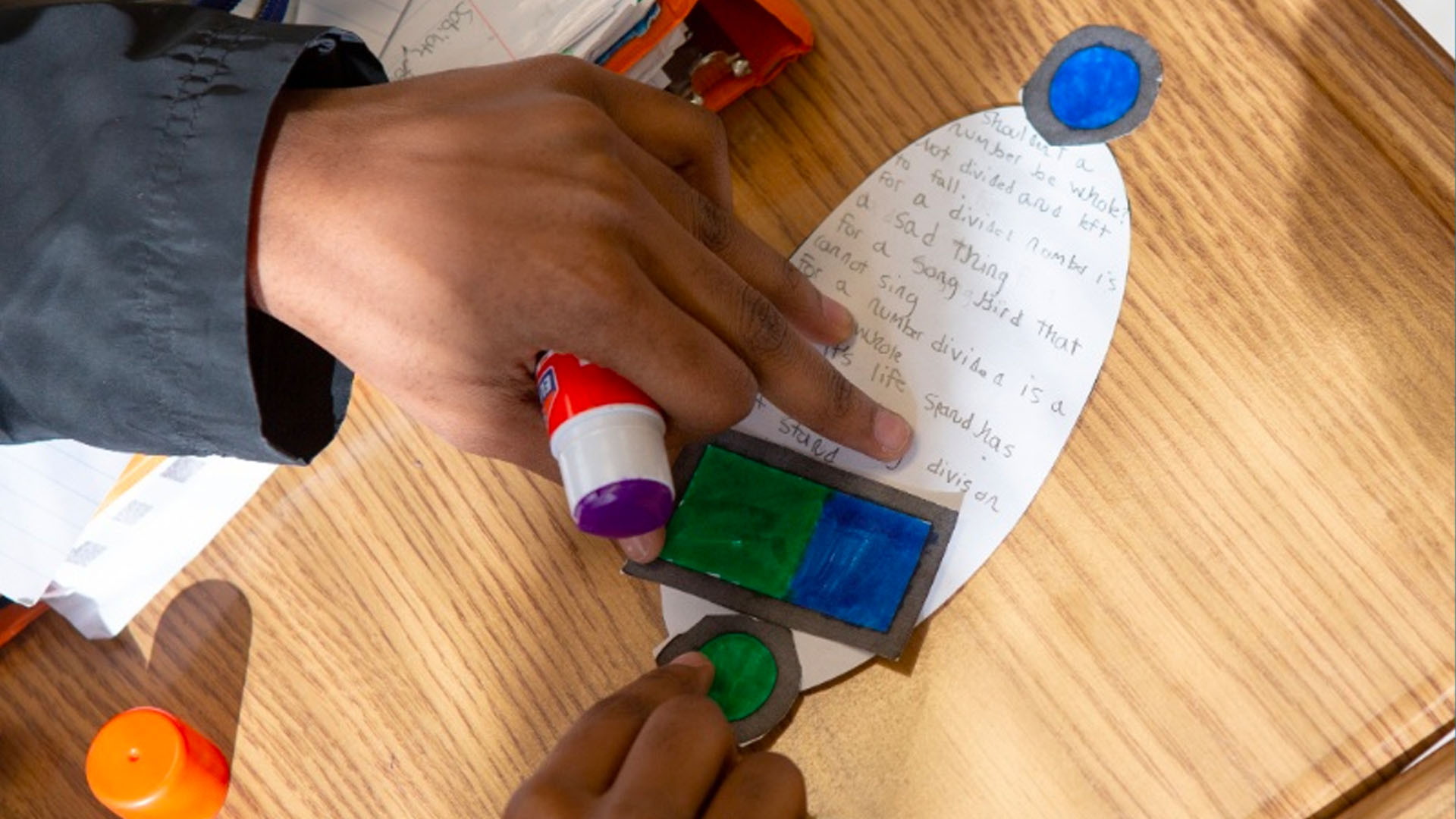 KInL - Math Classroom moving the needle student hands working on a project