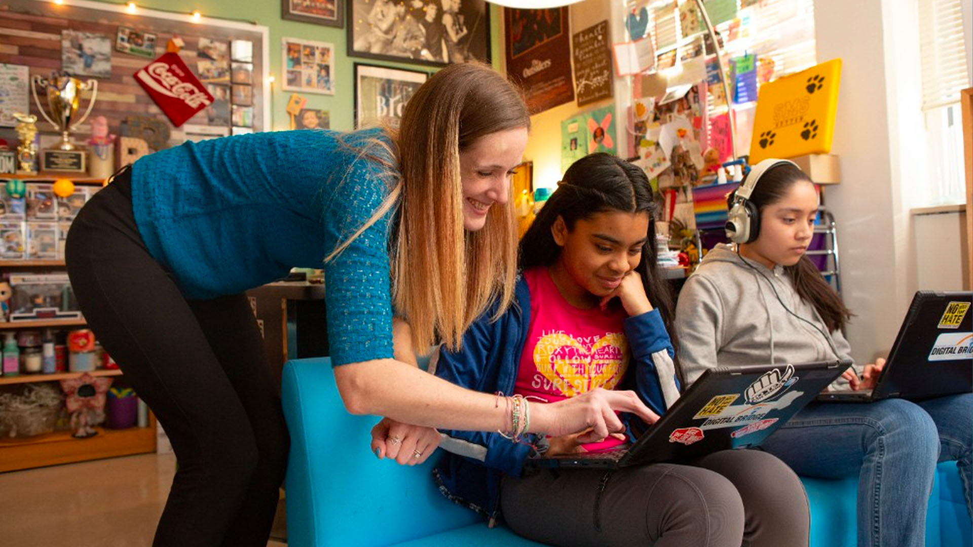 KInL Media Specialist with students media specialist working with students