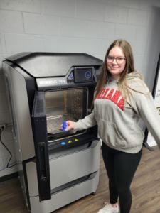 student at 3D printer
