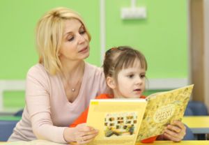 teacher and student reading together