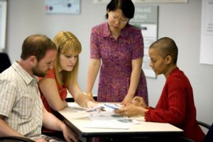 People in a discussion at a table.