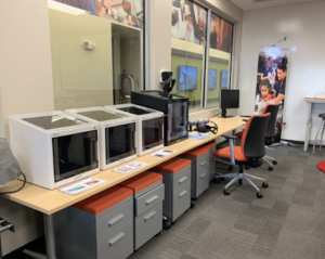 3D Printers on display in a classroom.