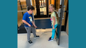 Two students sweeping