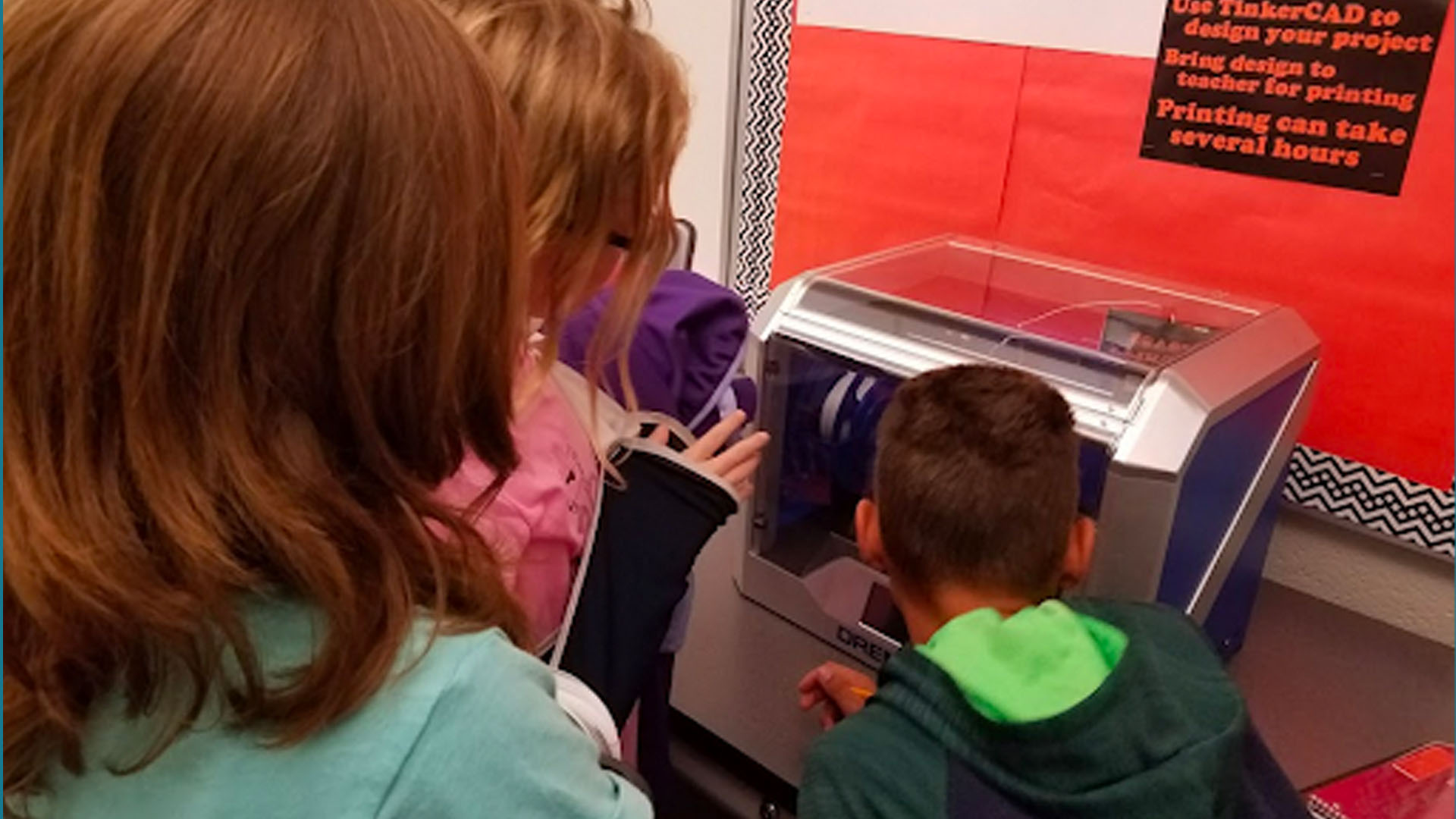 Students watching a 3D Printer