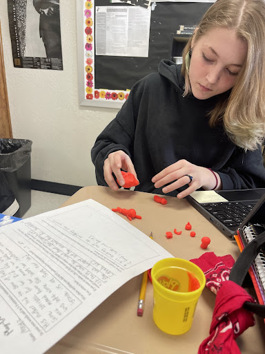 Student creating with Play-doh Student working with Play-Doh