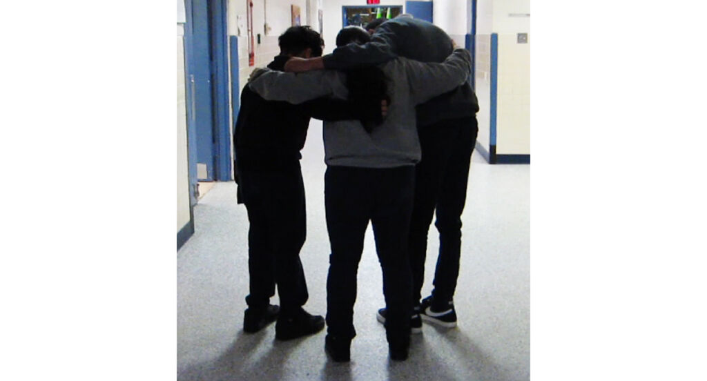 Students huddled in conversation.