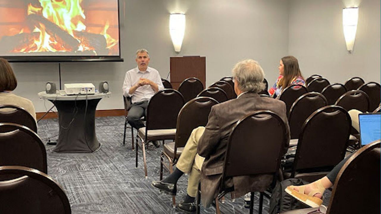 Image of people. gathered at a Conference