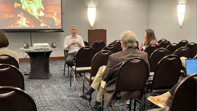 Image of people. gathered at a Conference