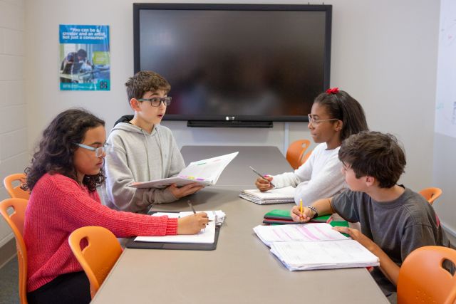 Students from Sutton Middle School’s debate team practice for an upcoming competition.