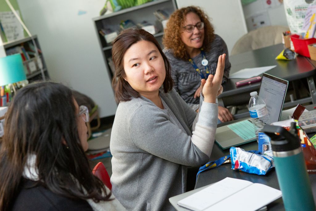 Teacher shares plans during a team meeting session.