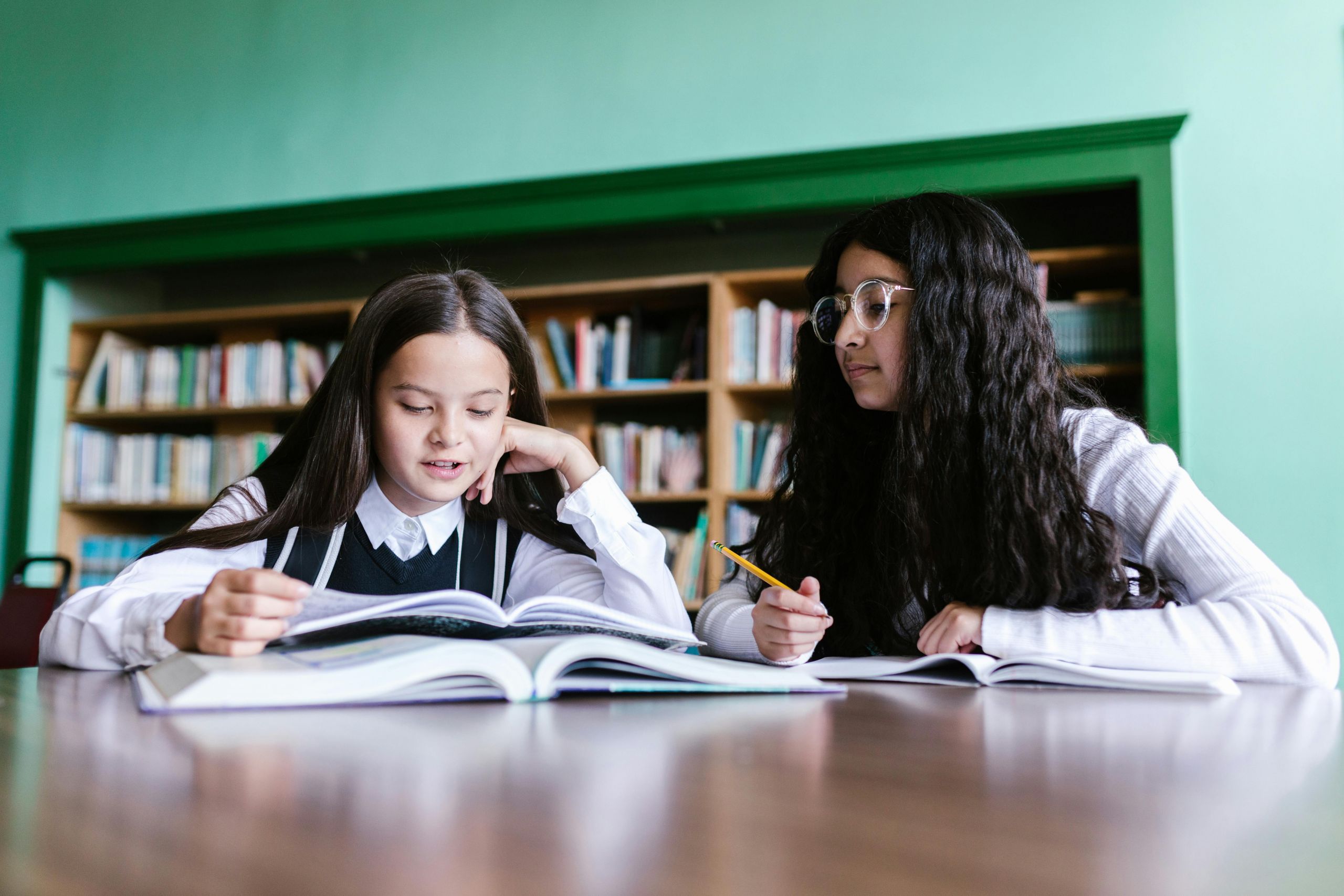 pexels-rdne-8500354 Two girls studying in the library.
