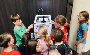 Students using a 3D Printer.
