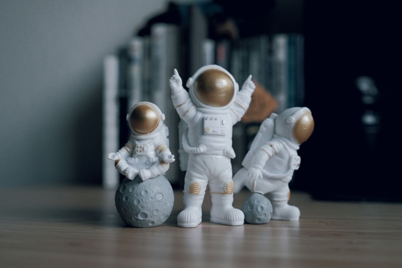 Three astronaut figurines.