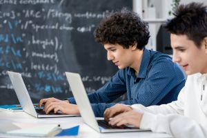 Students using laptops.
